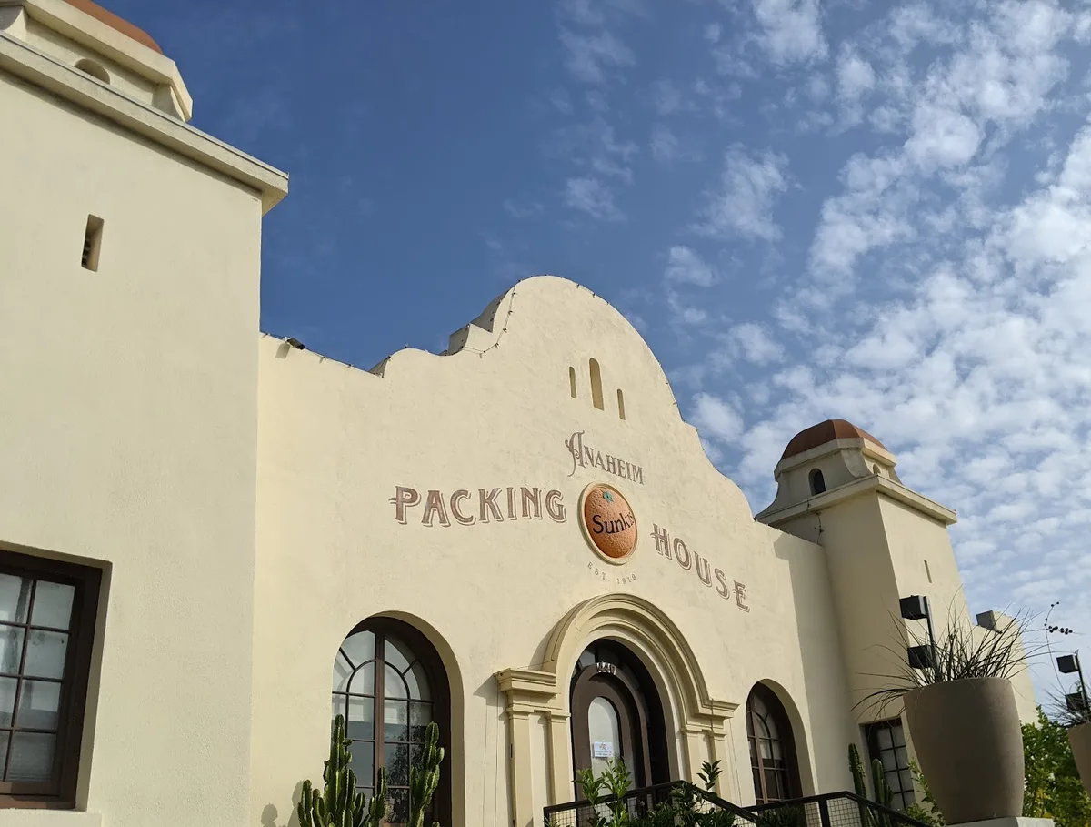 Anaheim Packing House’s curved façade, citrus emblem and arched entrance